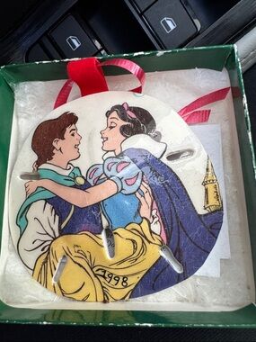 Disney ornament Snow White, and prince florian on a sand dollar seashell vintage